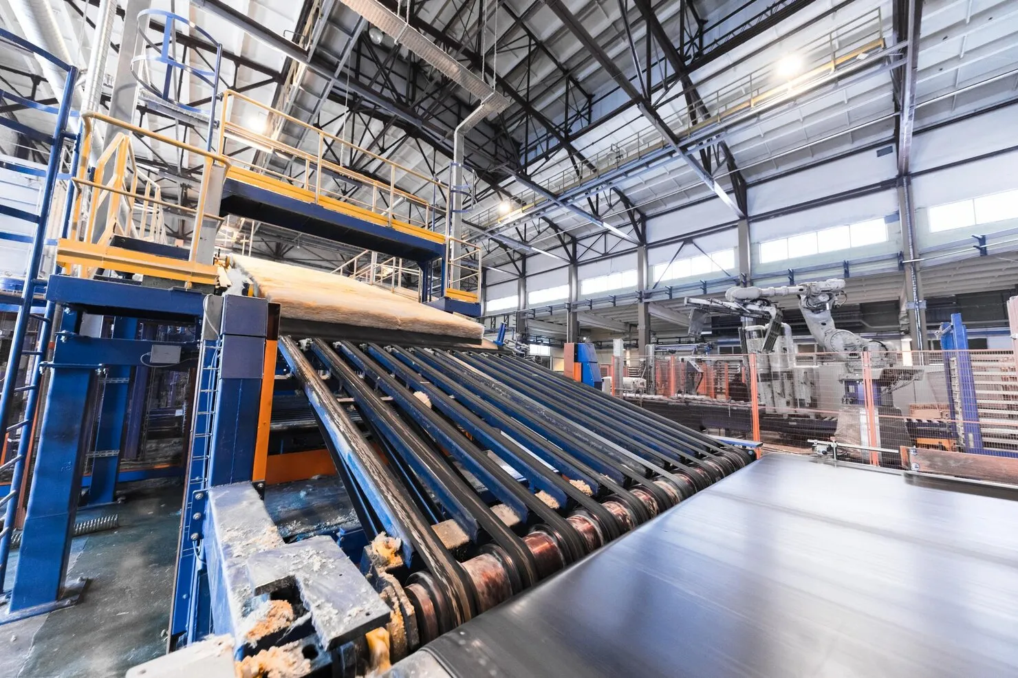 modern operational plant equipment assembly line producing fiberglass batt heavy industry machinery metalworking workshop concept